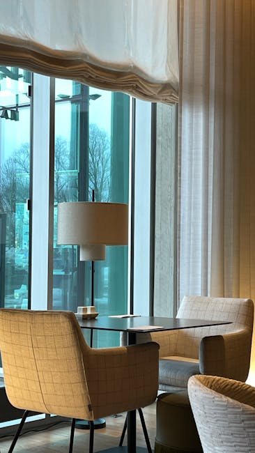 Modern eye care clinic interior with comfortable seating area and natural lighting
