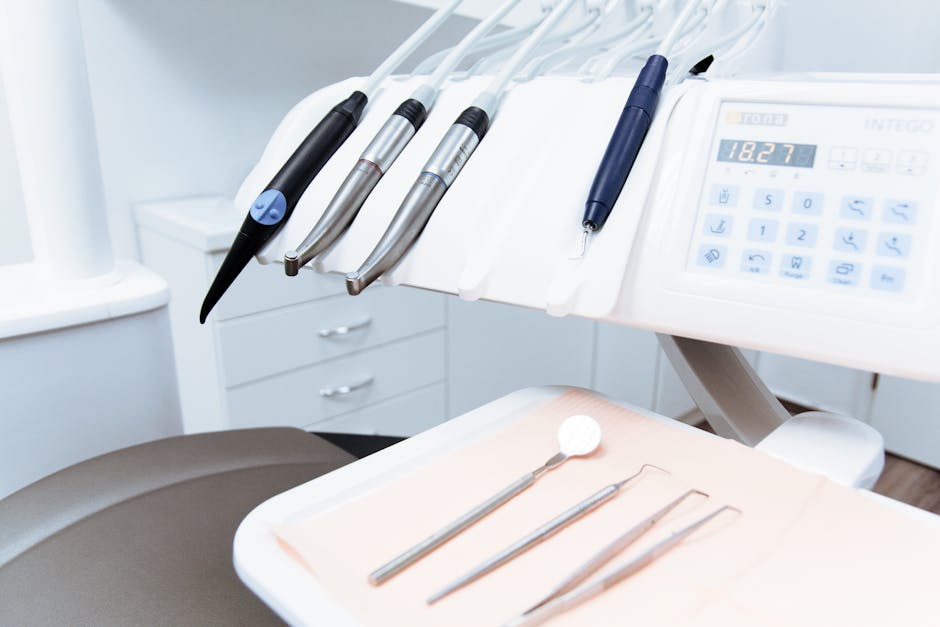 Professional doctor in white coat smiling in modern medical office with eye care equipment